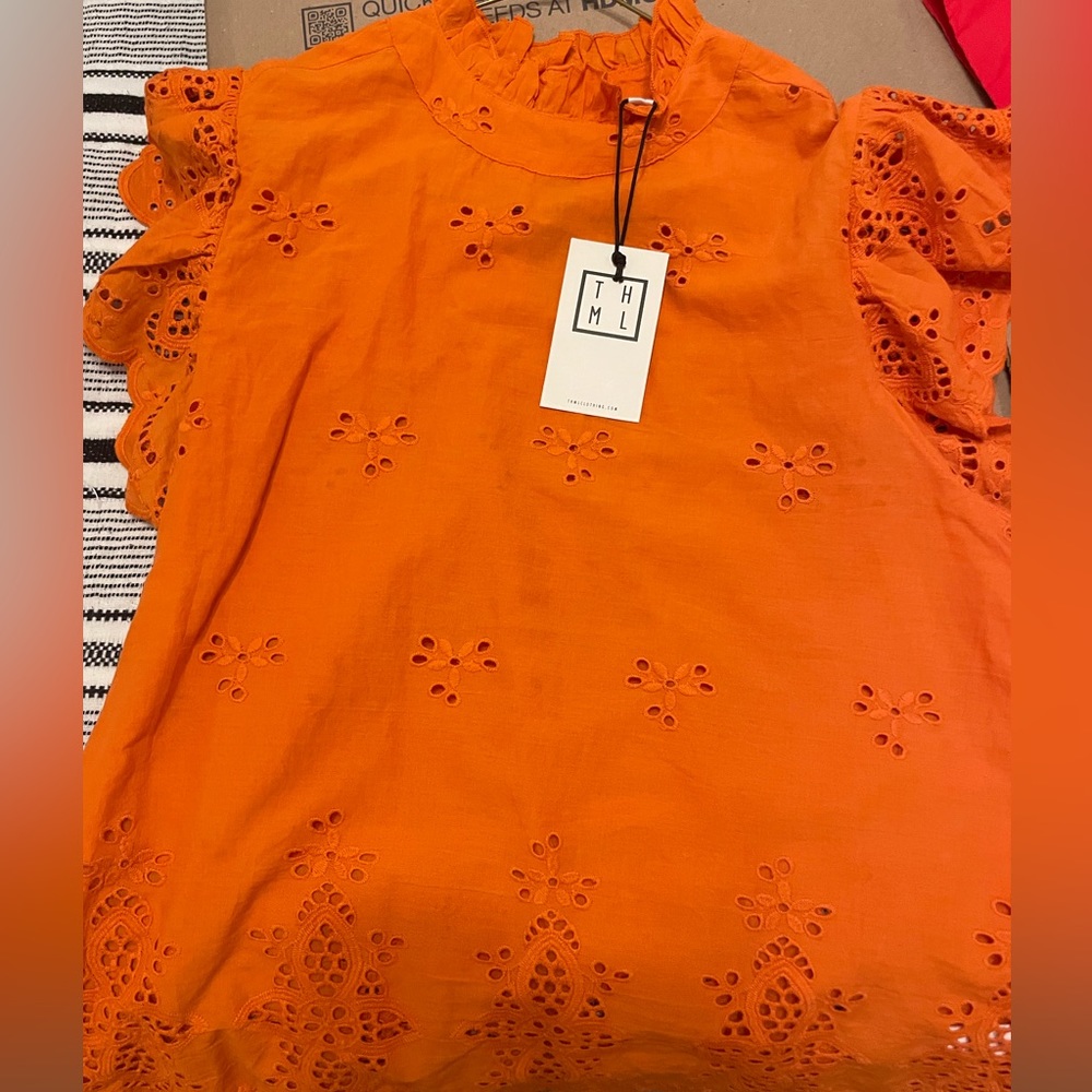 Orange women’s top. Brand new with tags